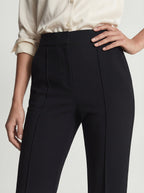 High-waisted pleated straight-leg pants